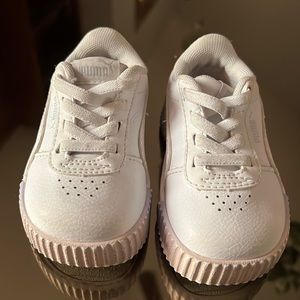 White leather Puma sneaker in size 4C. Gently used.